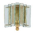 Front view showing symmetrical layout of curved textured glass panes on gold finished sconce