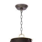 Top ceiling canopy and chain links in blackened metal attached to natural brass loop on chandelier