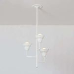 Alora chandelier showing the three floral shades illuminated with warm light from front angle