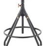 Side view focusing on stool’s footrest and angled metal legs with brass detailing