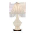 Musetta Table Lamp with hexagonal faux leather wrapped base in ivory and antique brass ring near the bottom