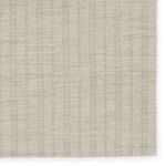 Top-down view on corner area emphasizing thin, closely woven ticking stripes