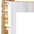 Close-up of lamp's top arm and cylindrical LED light panel in antique brass