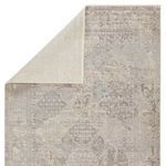 Back corner of Lourdes Trellis rug folded to reveal solid cream underside