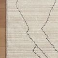 Corner view showing Darby rug’s binding and placement on light wood floor
