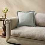Azure Manor Pillow styled on beige upholstered sofa in cozy living room setting