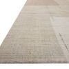 Low angle side view showing rug’s flat weave texture and subtle color transitions