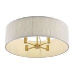 View from slightly angled bottom highlighting warm brass frame within soft white rope shade