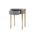 Bodrum side table with drawer partially open revealing oak interior and brass base legs