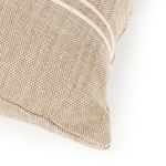 Close corner view showing neat stitching and textured jute weave of pillow fabric