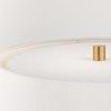 Top view of the white lamp shade with gold finial on top