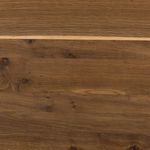 Close-up of wood surface texture highlighting knots and natural oak streaks