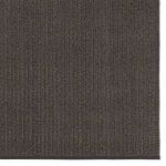 Close-up of rug surface showing parallel ribbed handwoven texture in dark gray