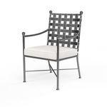 Front angle of Provence Dining Chair emphasizing woven iron back and thick white cushion