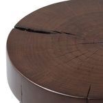 Close-up of table top edge showing smooth dark brown finish and pronounced wood grain cracks