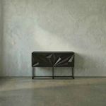 Zurich Console in ebony with black walnut wood and bold hand-carved diamond and rhombus patterns on four doors, slim metal...