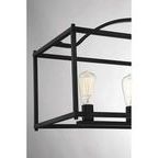 Close-up of matte black metal frame and Edison bulb filament detail