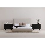 Styled bedroom scene with Luzon Tall Headboard Bed on beige rug flanked by black wood nightstands
