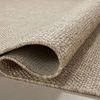 Side view showing thickness and flexibility of tightly woven polypropylene rug