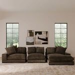 Three-piece Plunge sofa sectional in dark gray corduroy fabric arranged in minimalist living room.