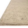 Close-up angled view showing ribbed texture and thickness of natural wool rug edge