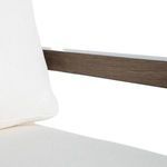 Close-up of oak wood frame with chevron-patterned raffia woven back detail