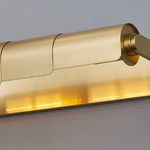 Close-up of the front and side view showing smooth rounded edges and brass texture of the picture light