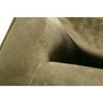 Inset view of the gap between back cushion and side armrest showing fabric folds and construction