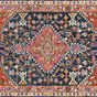 Navy and white wool rug with bold central medallion and intricate floral border with tassels
