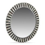Isolde mirror viewed from an angled side perspective showing its round shape and frame depth
