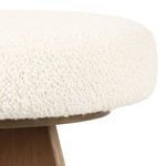 Side close-up of rounded edge and fabric texture on Ivory boucle upholstered seat cushion