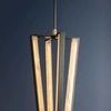 Edgemere Pendant showing full pendant from side angle against dark background, illuminated alabaster panels visible