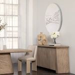 Marci Sideboard styled in a room with dining table, chair, wall art, and decorative vases on top