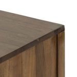 Detailed view of two iron drawer handles highlighting modern hardware style