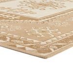 Close-up low angle view of Enver rug corner showing woven texture and beige pattern detail