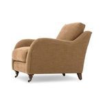 Lynne chair angled side view showing profile and cushioning depth