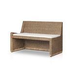 Large close-up of light beige fabric texture on tufted dining bench cushion