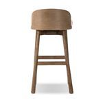 Back view showing full curved wooden backrest and wooden legs with footrest bars