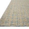 Polly Blue / Sand Rug angled view showing low pile texture and thin profile