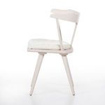 Ripley Dining Chair angled side view focusing on armrest curve and backrest support bars