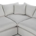 Top-down view into corner of sectional showing arrangement of cushions and smooth seat surface