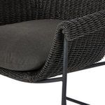Close-up of dark textured upholstery fabric of fully padded seat cushion