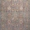 Close-up vertical view of full rug pattern highlighting varied motifs and faded tones