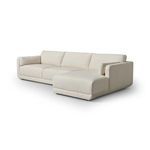 Three-quarter angled view showing curved armrest and chaise side profile of the sectional