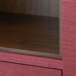 Close-up of open shelf interior revealing dark wood grain contrasting with red textured exterior