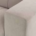Close-up detail of rounded, extrawide armrest showing seam and fabric texture