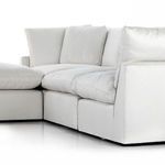 Angled perspective showing seating cushions' softness and fabric drape