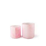 Set of two pink alabaster octagonal vases in different sizes shown together on white background