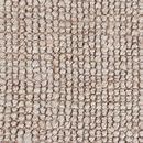 Close-up of chunky boucle weave showing natural jute fiber texture and handwoven pattern