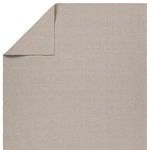 Rug corner flipped to reveal solid taupe backing in flat weave